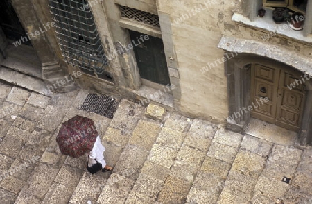 A smal road in the centre of the Old Town of the city of Valletta on the Island of Malta in the Mediterranean Sea in Europe.
