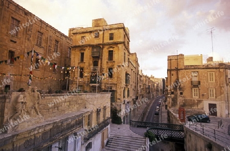 A smal road in the centre of the Old Town of the city of Valletta on the Island of Malta in the Mediterranean Sea in Europe.
