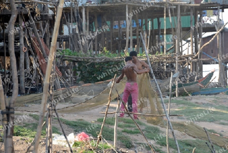 The People at wort in the Lake Village Kompong Pluk at the Lake Tonle Sap near the City of Siem Riep in the west of Cambodia.