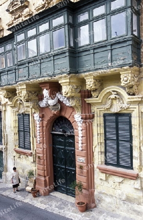 The traditional Balconys on the Houses in the Old Town of the city of Valletta on the Island of Malta in the Mediterranean Sea in Europe.
