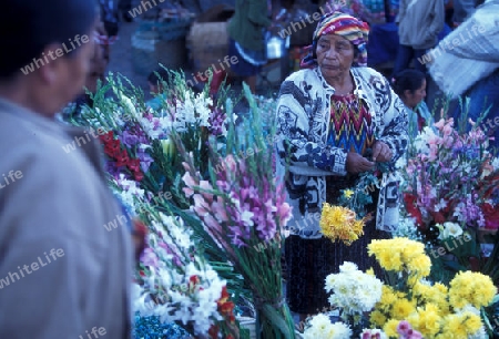 people in traditional clotes at the Market in the Village of  Chichi or Chichicastenango in Guatemala in central America.   