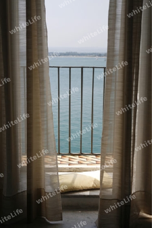 a Balcony an the seaside in the old Town of Siracusa in Sicily in south Italy in Europe.