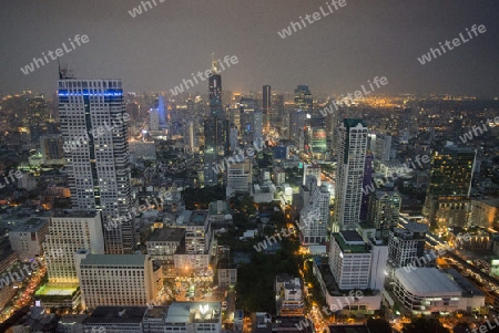 The Skyline view from the Sky Bar at the Riverside Aerea in the city of Bangkok in Thailand in Southeastasia.