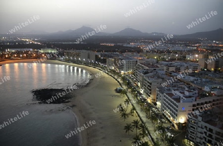 The promenade of the old town of the City of Arrecife on the Island of Lanzarote on the Canary Islands of Spain in the Atlantic Ocean. on the Island of Lanzarote on the Canary Islands of Spain in the Atlantic Ocean.
