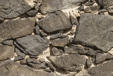 eine Mauer aus graue, verwitterten Sandstein mit unregelm??ig gebrochener Oberfl?che