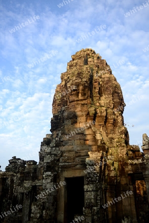 Stone Faces the Tempel Ruin of Angkor Thom in the Temple City of Angkor near the City of Siem Riep in the west of Cambodia.