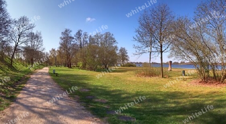 Beautiful high resolution panorama of a northern european country landscape with fields and green grass.