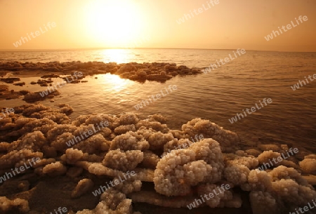 The coast with natural salt of the death sea neat the Village of Mazraa in Jordan in the middle east.