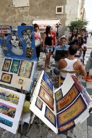 a Painter in the old Town of  Taormina in Sicily in south Italy in Europe.