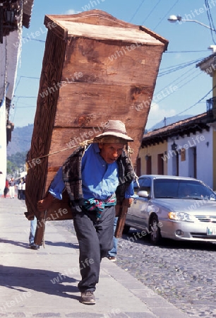 a men works in the old town in the city of Antigua in Guatemala in central America.   