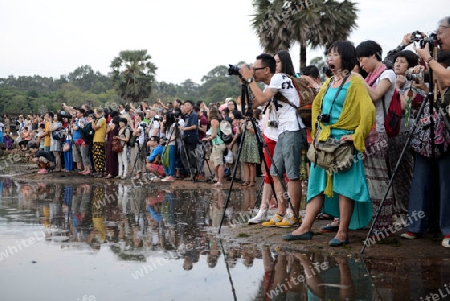 Tourists at the Angkor Wat in the Temple City of Angkor near the City of Siem Riep in the west of Cambodia.