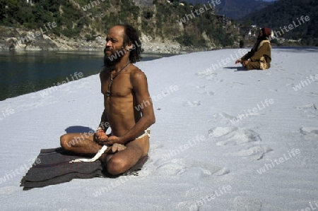 two men on the Ganges River in the town of Rishikesh in the Province Uttar Pradesh in India.