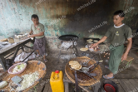 a Restaurant near the Town of Myingyan southwest of Mandalay in Myanmar in Southeastasia.