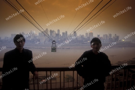 the cable car on the way over the yangzee River in the city of Chongqing in the province of Sichuan in china in east asia. 