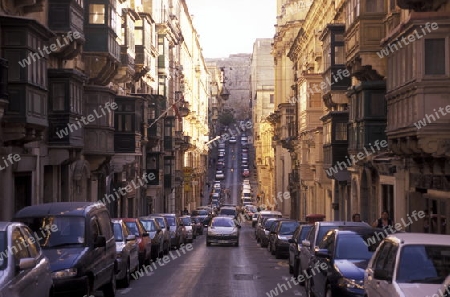 A smal road in the centre of the Old Town of the city of Valletta on the Island of Malta in the Mediterranean Sea in Europe.

