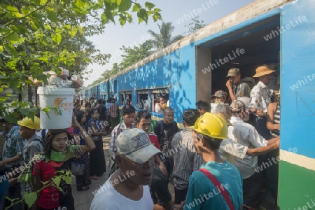 a train of the Yangon circle train in a trainstation near the City of Yangon in Myanmar in Southeastasia.