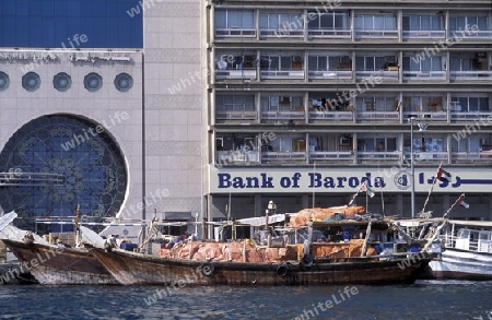 the bank of baroda on the Dubai creek in the old town in the city of Dubai in the Arab Emirates in the Gulf of Arabia.