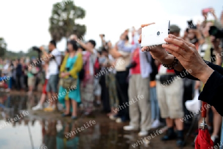 Tourists at the Angkor Wat in the Temple City of Angkor near the City of Siem Riep in the west of Cambodia.