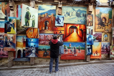 a shop in the Marketroad in the Medina of old City in the historical Town of Fes in Morocco in north Africa.