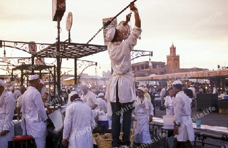 The Streetfood and Nightlife at the Djemma del Fna Square in the old town of Marrakesh in Morocco in North Africa.
