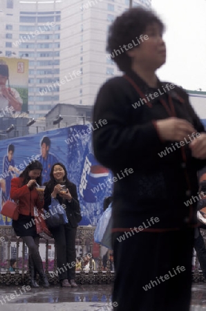 People at the main square in the city of Chongqing in the province of Sichuan in china in east asia. 