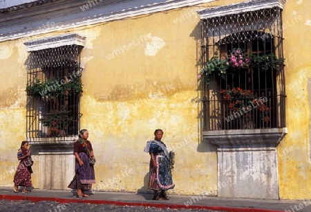  indio women in the old town in the city of Antigua in Guatemala in central America.   