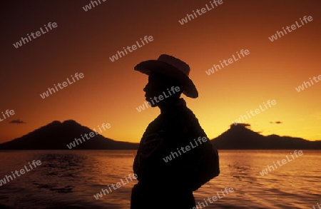 The Lake Atitlan mit the Volcanos of Toliman and San Pedro in the back at the Town of Panajachel in Guatemala in central America.   