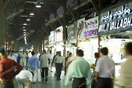 a shopping street in the souq or Market in the old town in the city of Dubai in the Arab Emirates in the Gulf of Arabia.