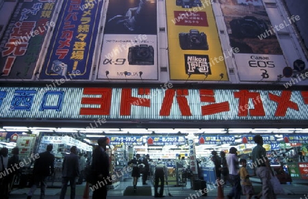 A Road with Shopping and Trafic in the City centre of Tokyo in Japan in Asia,



