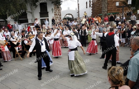 a traditional Dance in the old town of Teguise on the Island of Lanzarote on the Canary Islands of Spain in the Atlantic Ocean. on the Island of Lanzarote on the Canary Islands of Spain in the Atlantic Ocean.
