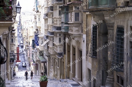 A smal road in the centre of the Old Town of the city of Valletta on the Island of Malta in the Mediterranean Sea in Europe.
