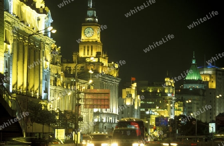 the Bund in front of the skyline of Pudong in the City Shanghai in China.