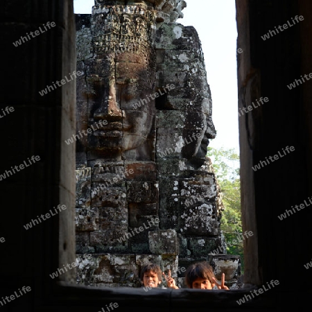 Stone Faces the Tempel Ruin of Angkor Thom in the Temple City of Angkor near the City of Siem Riep in the west of Cambodia.