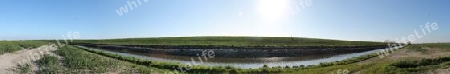 Beautiful high resolution panorama of a northern european country landscape with fields and green grass.