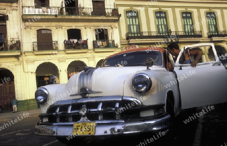 old cars in the old townl of the city of Havana on Cuba in the caribbean sea.