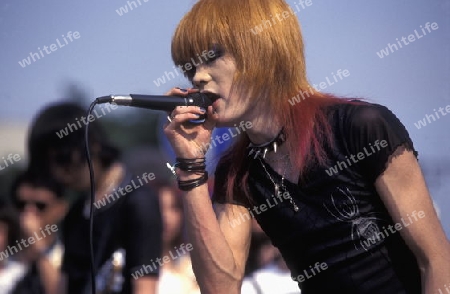 a Japanese Youth Punk Band plays on a square in the City of Tokyo in Japan in Asia,



