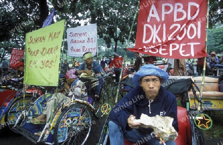 a riksha taxi driver Protest in the city centre of Jakarta in Indonesia in Southeastasia.