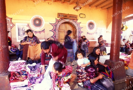 people in traditional clotes at the Market in the Village of  Chichi or Chichicastenango in Guatemala in central America.   