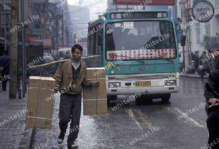 Transport people at the main square in the city of Chongqing in the province of Sichuan in china in east asia. 