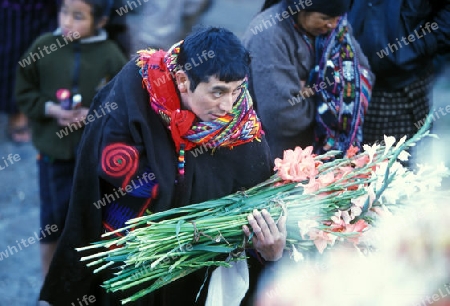 people in traditional clotes at the Market in the Village of  Chichi or Chichicastenango in Guatemala in central America.   