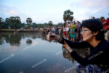 Tourists at the Angkor Wat in the Temple City of Angkor near the City of Siem Riep in the west of Cambodia.