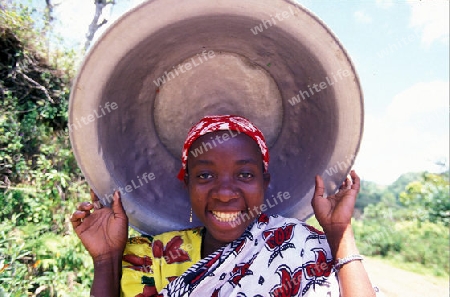 a women in the city of Moutsamudu on the Island of Anjouan on the Comoros Ilands in the Indian Ocean in Africa.   