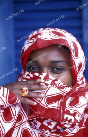 a women in the city of Moutsamudu on the Island of Anjouan on the Comoros Ilands in the Indian Ocean in Africa.   