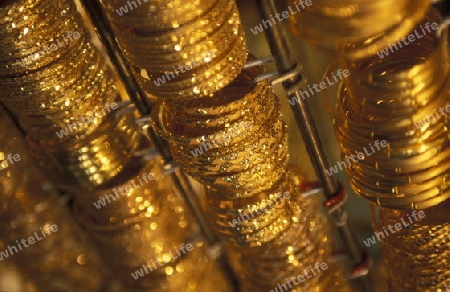 a Gold shop the souq or Market in the old town in the city of Dubai in the Arab Emirates in the Gulf of Arabia.