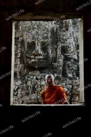 Stone Faces the Tempel Ruin of Angkor Thom in the Temple City of Angkor near the City of Siem Riep in the west of Cambodia.