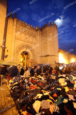 a smal Marketroad in the Medina of old City in the historical Town of Fes in Morocco in north Africa.