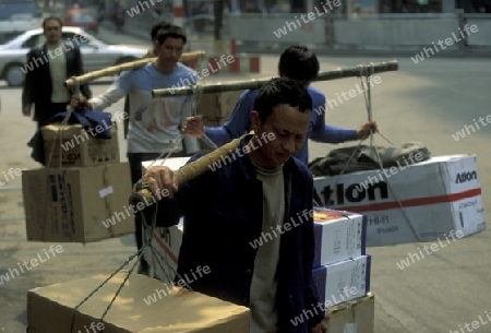 Transport people at the main square in the city of Chongqing in the province of Sichuan in china in east asia. 