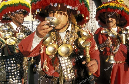 Traditional water seller at the Djemma del Fna Square in the old town of Marrakesh in Morocco in North Africa.
