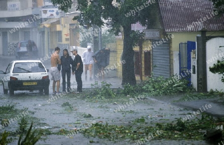 a tropical storm in the town of  St Gilles les Bains  on the Island of La Reunion in the Indian Ocean in Africa.