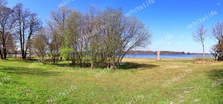 Beautiful high resolution panorama of a northern european country landscape with fields and green grass.